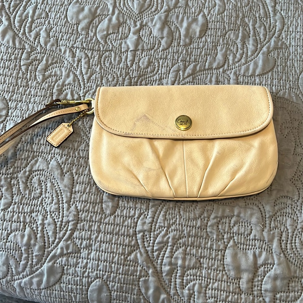 Cream color wristlet Coach